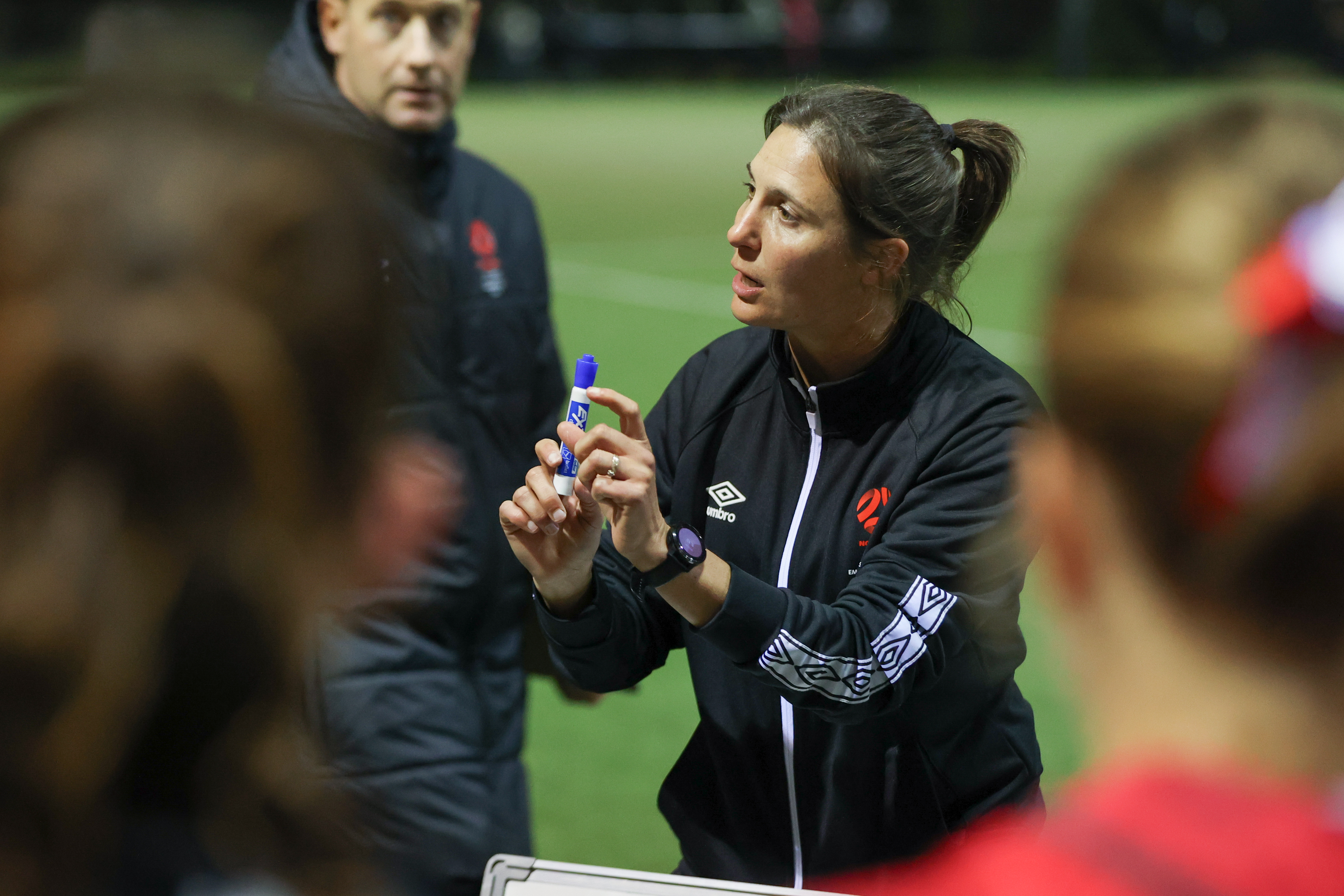 Helen Moseley coaching Northern NSW during a match